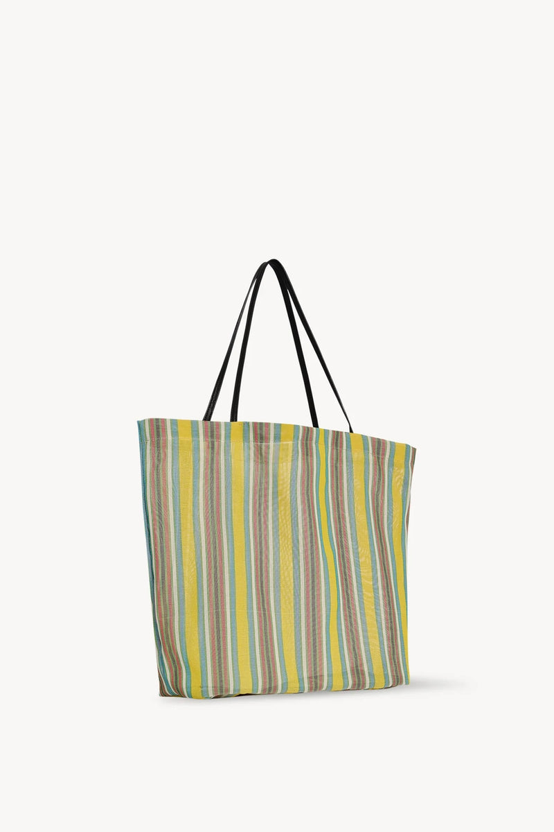 Side slanted view of mesh and leather bag on white background, with no model shown.