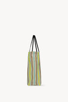 Side view of mesh and leather bag on white background, with no model shown.