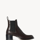 Right side view of brown nobilis boot on white background, with no model shown.