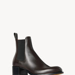 Right slanted view of brown nobilis boot on white background, with no model shown.