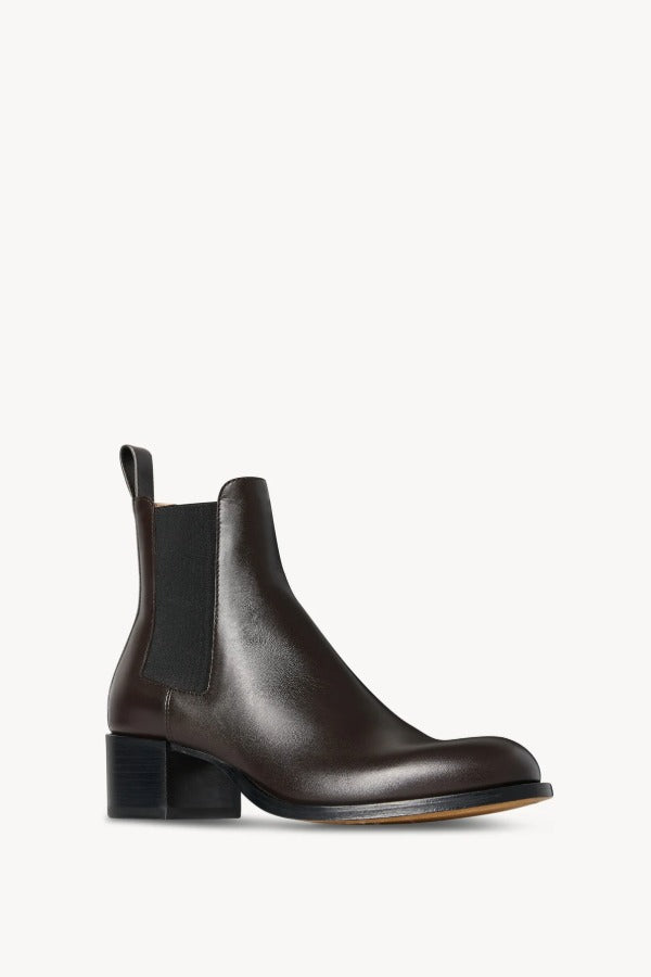 Right slanted view of brown nobilis boot on white background, with no model shown.