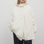 Front view of off-white Kemetina Coat on model wearing black trousers, against white background.