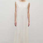 Front view of off-white Nicole dress on white background with model wearing sandals.