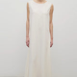 Front view of off-white Nicole dress on white background with model wearing sandals.