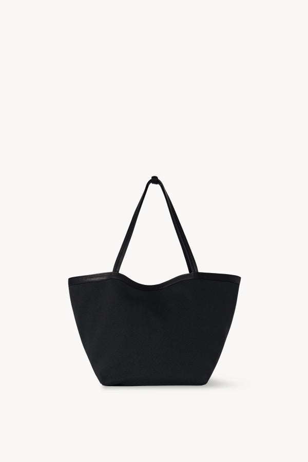Front view of black park tote three canvas on white background, with no model shown.