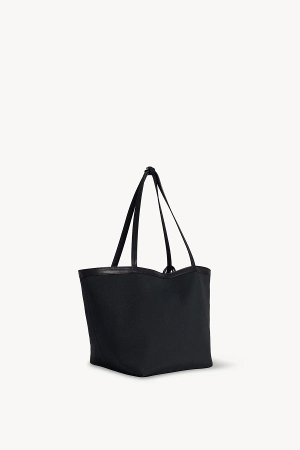 Front slanted view of black park tote three canvas on white background, with no model shown.