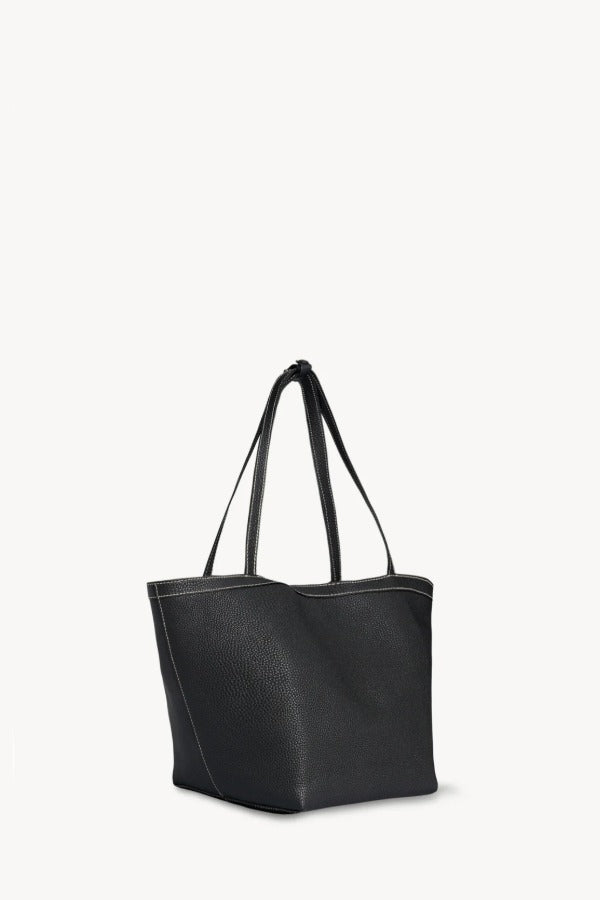 Front slanted view of black park tote three stitch on white background, with no model shown.