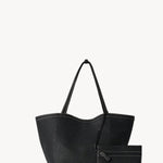 Front view with zip pouch of black park tote three stitch on white background, with no model shown.