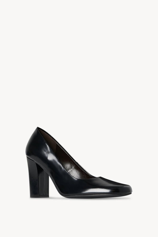 Right side slanted view of black penelope pump on white background, with no model shown.