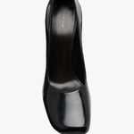 Overhead view of black penelope pump on white background, with no model shown.