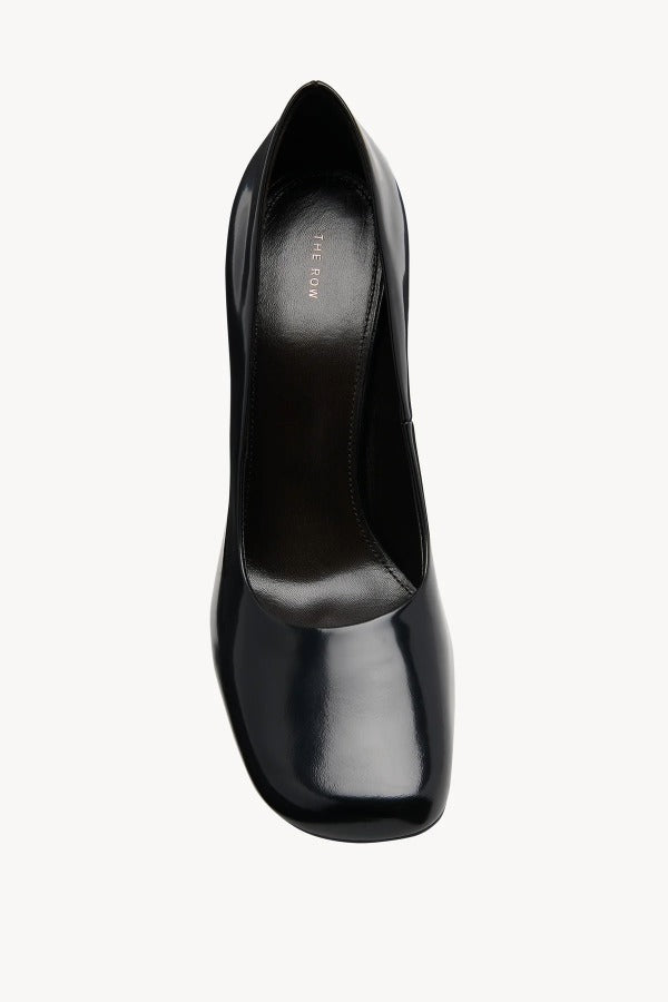 Overhead view of black penelope pump on white background, with no model shown.