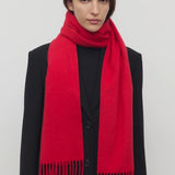 Front view of goji berry perico scarf on model wearing black suit, against a white background.