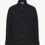 Front view of black petra shirt on white background, with no model shown.