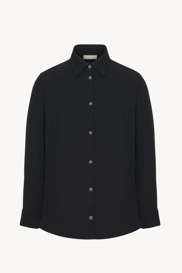 Front view of black petra shirt on white background, with no model shown.