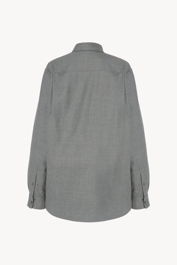Back view of grey pino shirt on white background, with no model shown.