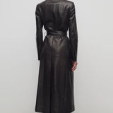 Back view of coffee raisa coat on model wearing low heels, against a white background.