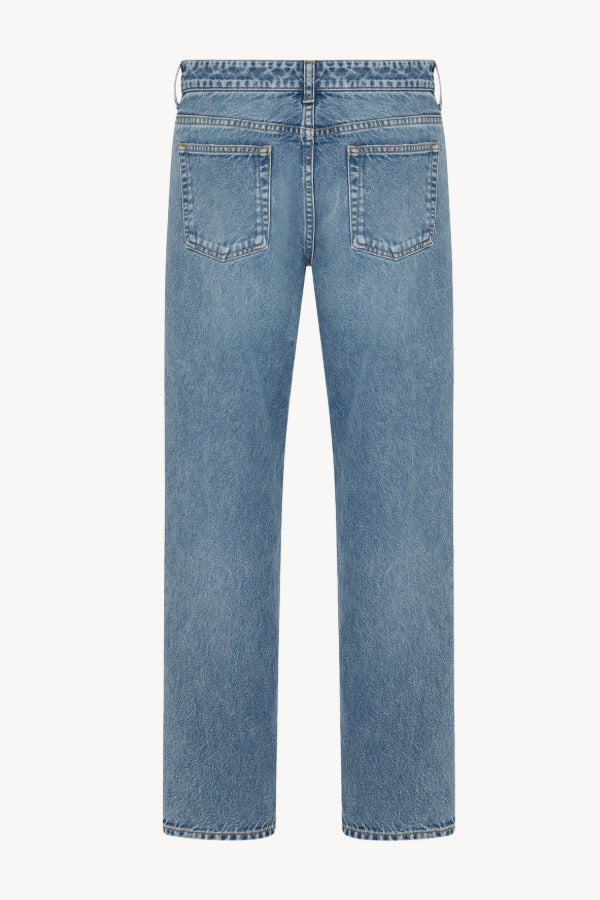 Back view of medium blue riaco jean on white background, with no model shown.