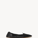 Right side view of black round ballet flats on white background, with no model shown.