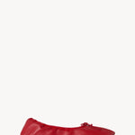 Right side view of red round ballet flats on white background, with no model shown.