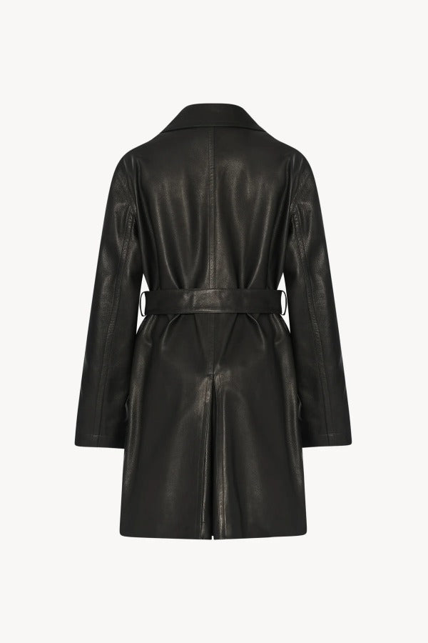 Back view of black siempra coat on white background, with no model shown.