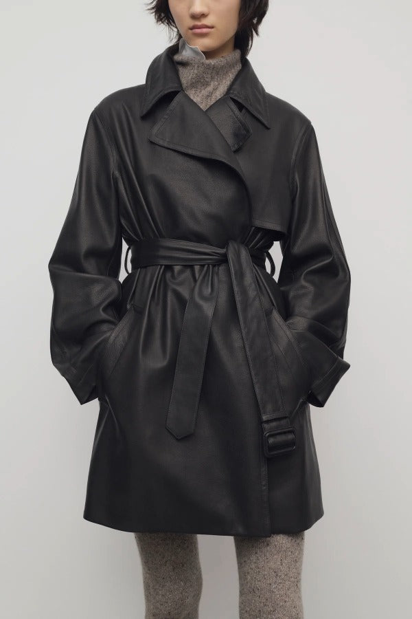 Front view of black siempra coat on model, against a white background.