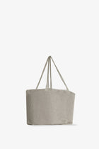 Side slanted view of steel mesh bag on white background, with no model shown.
