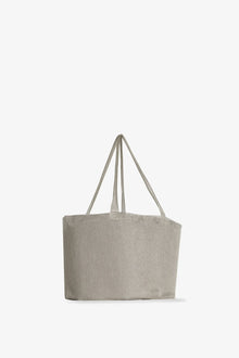 Side slanted view of steel mesh bag on white background, with no model shown.