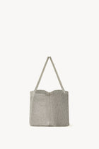 Side view of steel mesh bag on white background, with no model shown.