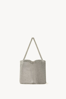 Side view of steel mesh bag on white background, with no model shown.