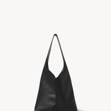 Front view of black small bindle stitch bag on white background, with no model shown.