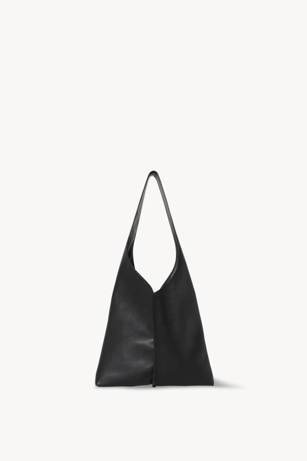 Front view of black small bindle stitch bag on white background, with no model shown.