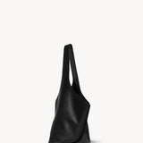 Side view of black small bindle stitch bag on white background, with no model shown.