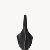Alternate side view of black small bindle stitch bag on white background, with no model shown.