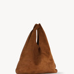 Front slanted view of bistre/ecru small suede bindle bag on white background, with no model shown.
