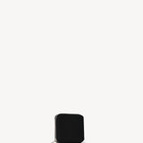 Front slanted view of black small zip wallet on white background, with no model shown.