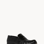 Front slanted view of black soft loafer in eel on white background with no model shown.