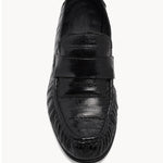 Overhead view of black soft loafer in eel on white background, with no model shown.