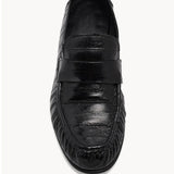 Overhead view of black soft loafer in eel on white background, with no model shown.