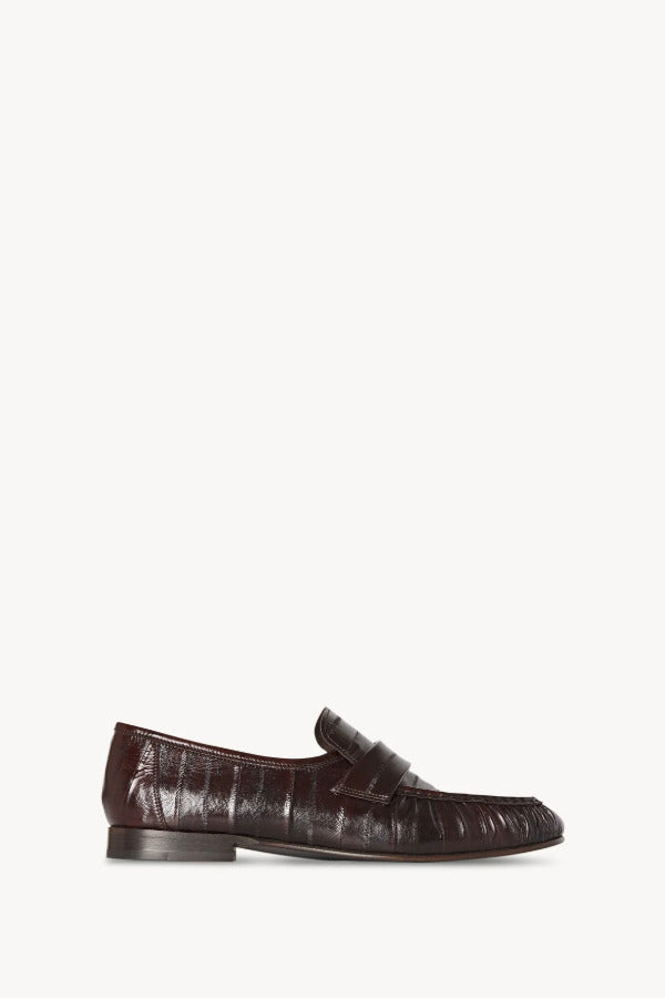 Right side view of brown soft loafer in eel on white background, with no model shown.