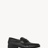 Right side slanted view of black soft loafer on white background, with no model shown.