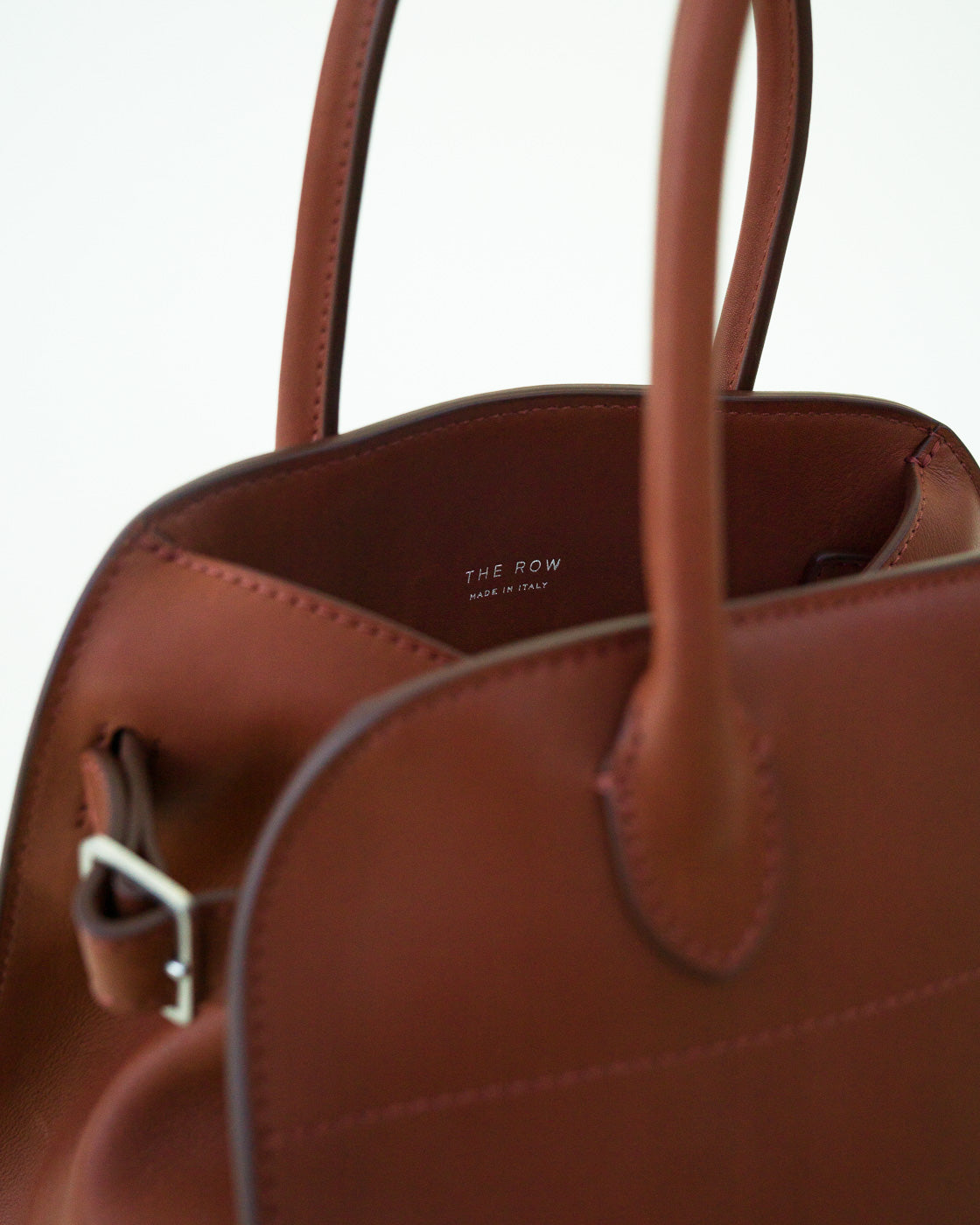 Closeup view of Soft Margaux 10 Bag in brown pictured on white background with no model