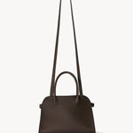 Shoulder strap view of deep brown soft margaux 10 bag on white background, with no model shown.