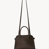 Shoulder strap view of deep brown soft margaux 10 bag on white background, with no model shown.
