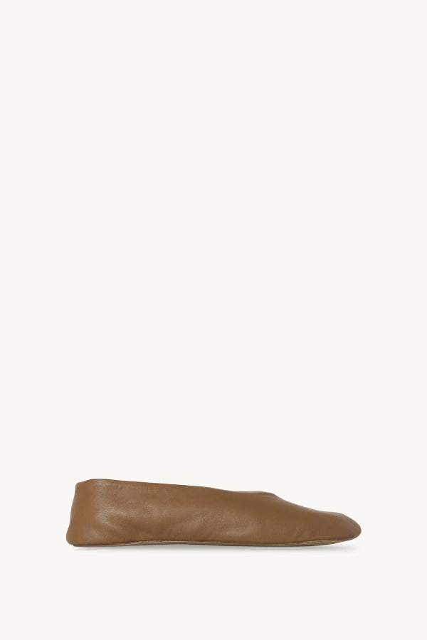 Right side view of mud stella slipper on white background, with no model shown.