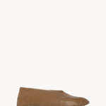 Front slanted view of mud stella slipper on white background, with no model shown.