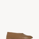 Front slanted view of mud stella slipper on white background, with no model shown.