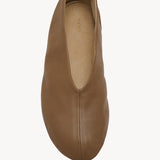 Overhead view of mud stella slipper on white background, with no model shown