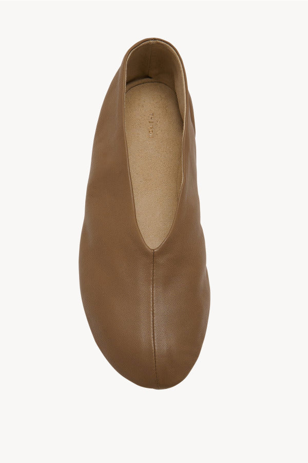 Overhead view of mud stella slipper on white background, with no model shown