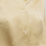 Front closeup view of sand takara shirt on model, against a white background.