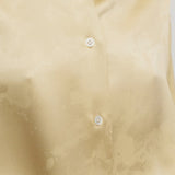 Front closeup view of sand takara shirt on model, against a white background.